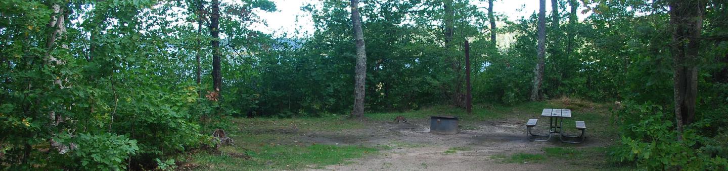 AuTrain Lake Campground site #15 full site view with table, fire pit, and picnic table. 