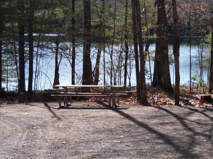 Two Lakes Campground site #78 with picnic table view among the trees.