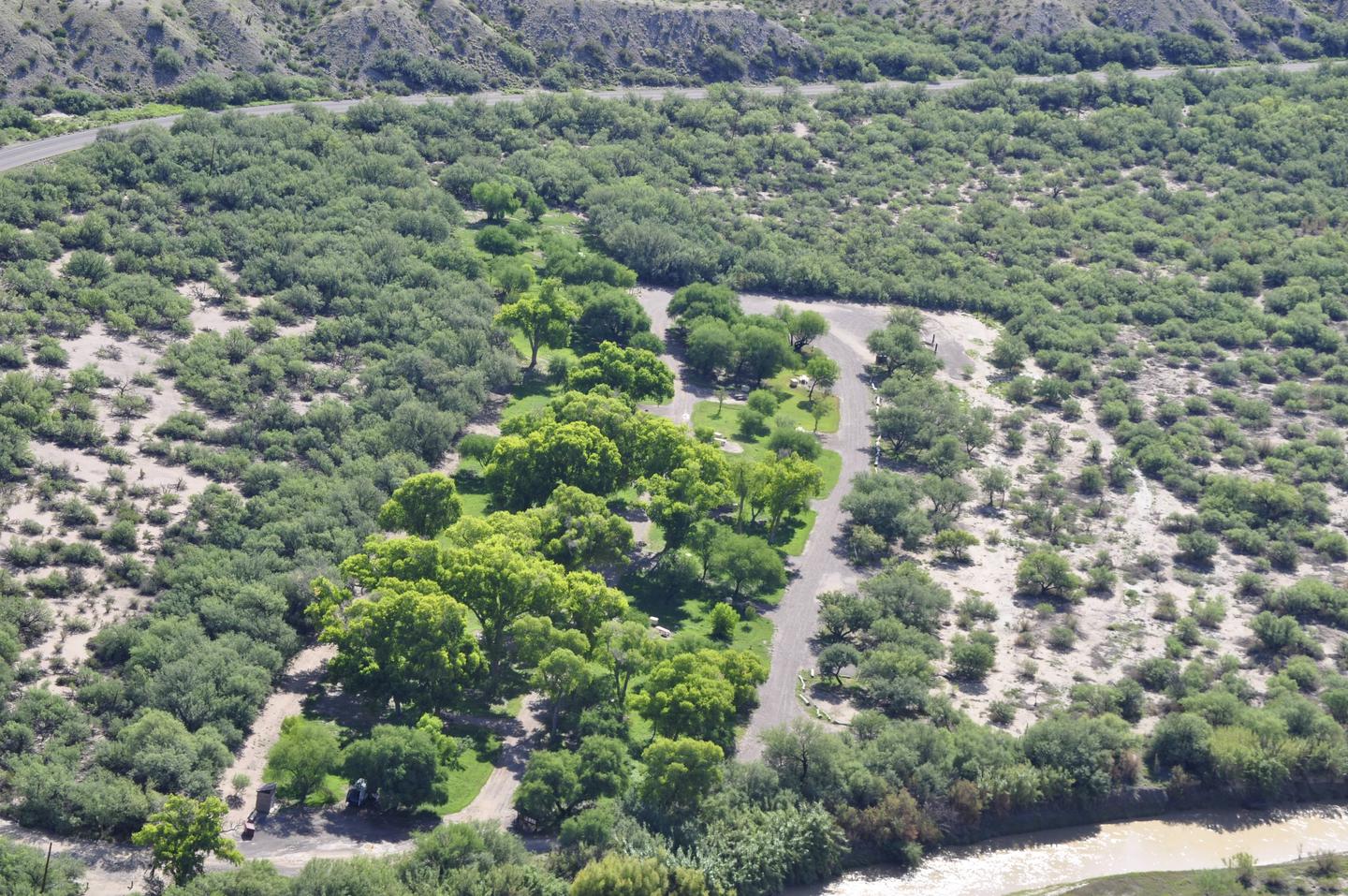 Aerial view of Cottonwood Campground, bright green trees amidst the low desert, riparian areaAerial view of Cottonwood Campground