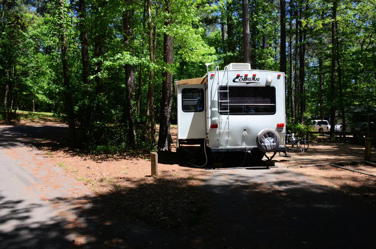 Pull-thru entrance, driveway slope, utilities-side clearance.McKinney Campground, campsite 128.