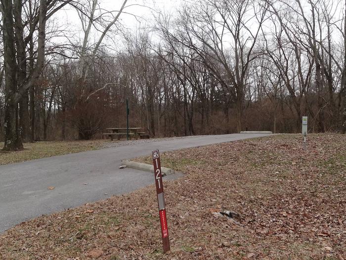 Picnic table and fire pit loacted on left side of camp pad. Electric, water, sewer located on right side. Additional parking spot loacted on right side