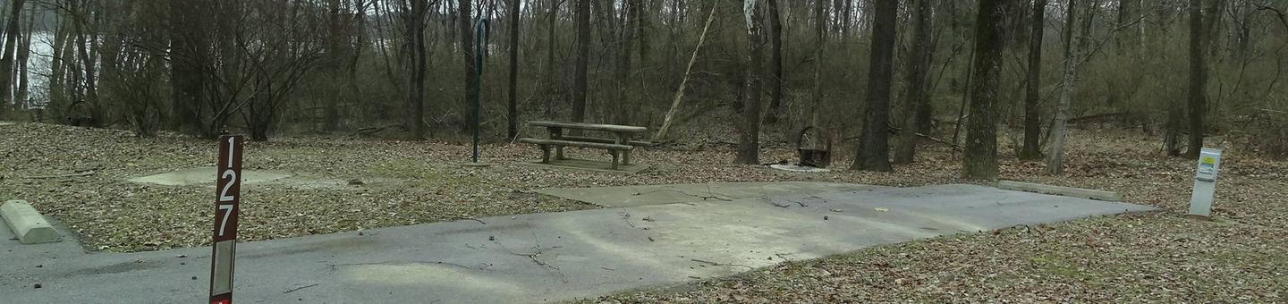 Picnic table, fire pit and extra parking located to the left of the camp pad electric locatedted on right of camp pad