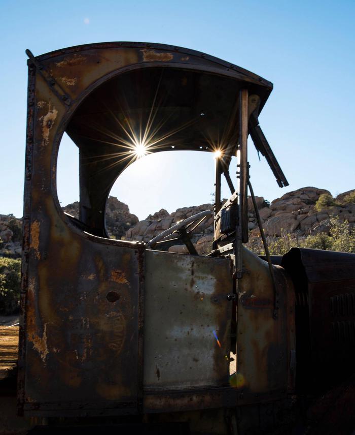 Sun streams through a rusted, old truck.Being so far from supplies and stores, the Keys family survived in the desert by making use of everything they owned.