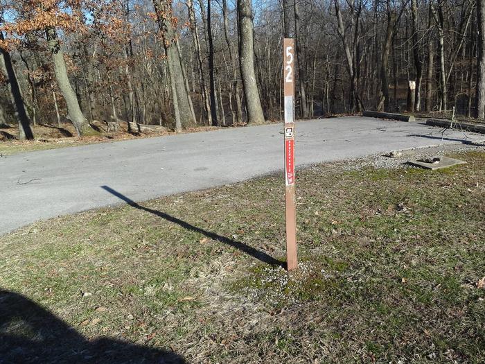 This site is located very close to a comfort station and drinking fountain. Picnic table and fire pit located to the left of the pad with hookups to the right side of the pad. This is a full hookup site. 