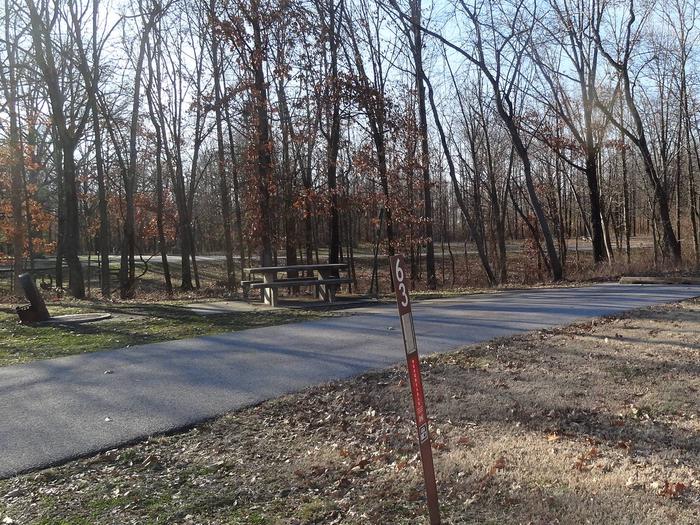 This is a full hookup site. Picnic table and fire pit are on the left side of the paved parking/camping pad. Hookups are on the right. This site is within walking distance to the comfort station. 