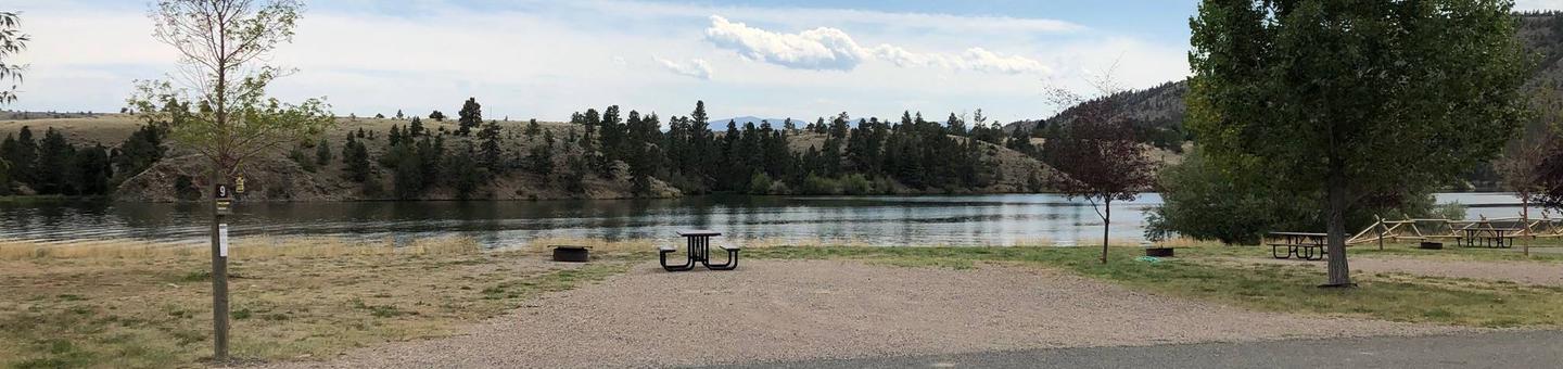 Site 9 BLM White Sandy Campground.  Lakeside campsite on Hauser Lake. Gravel camping pad with picnic table and fire pit. Paved access within campground.Site 9 BLM White Sandy Campground.