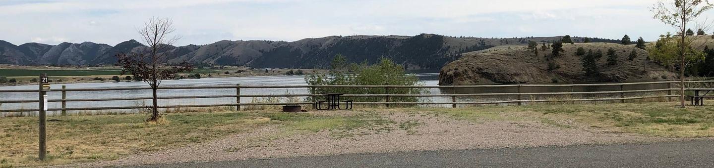 Site 21 at BLM White Sandy Campground. Paved access within campground. Gravel camping pad with fire pit and picnic table. No shade at this location. Lakeside campsite on Hauser Lake.Site 21 at BLM White Sandy Campground.