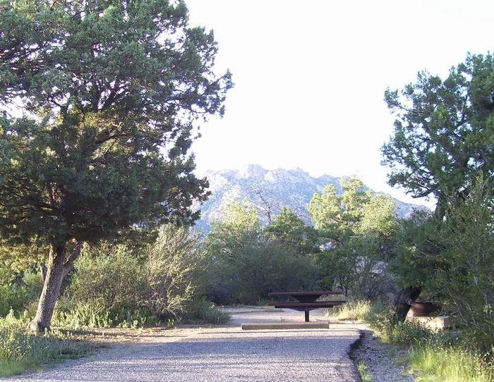 Yavapai Campground Site #15 with Granite Mountain in the Background behind the metal tableSite #15 with Granite Mountain in the Background 