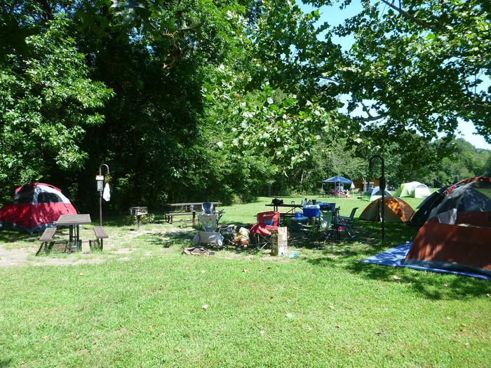 Group Site 2-4Group Site #2, Three picnic tables; two lantern holders; two charcoal cooking stands; one large fire pit.