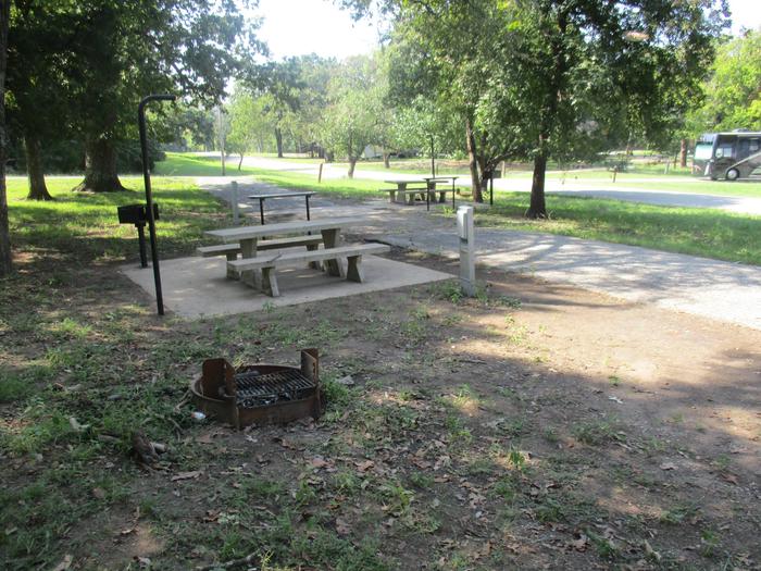 Site 19 table - Rocky PointThe drive backs up to site 18.  These sites are often rented together or family groups that need more than one site.  Please note that the electric pedestal and picnic table are on the same side.