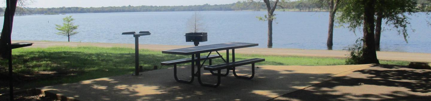 Site 13 - Flat RockSite 13 offers an excellent lake view with ample shade.