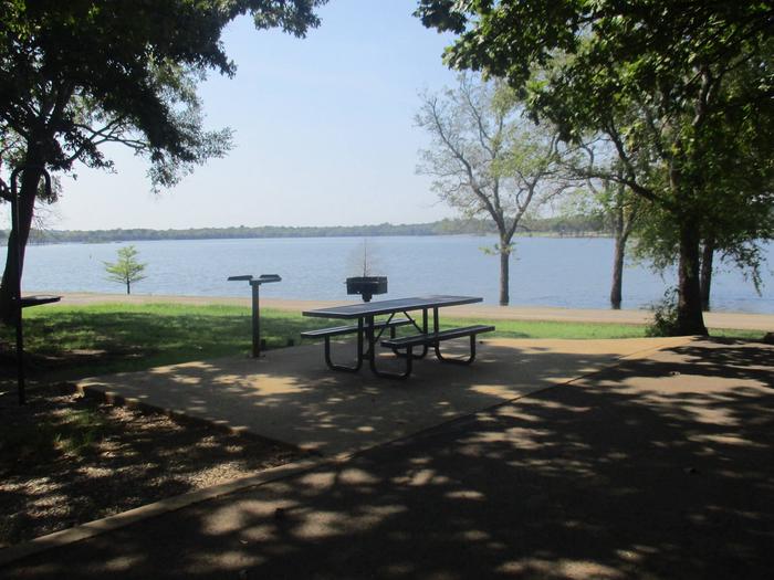Site 13 - Flat RockSite 13 offers an excellent lake view with ample shade.