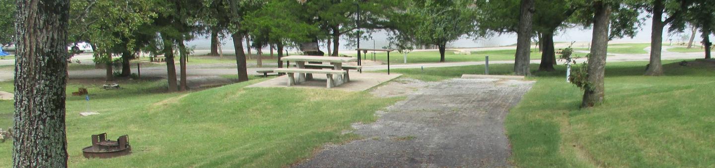 Site 16 - Rocky PointSite 16 offers an asphalt drive with concrete picnic table.