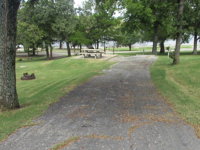 Site 16 - Rocky PointSite 16 offers an asphalt drive with concrete picnic table.