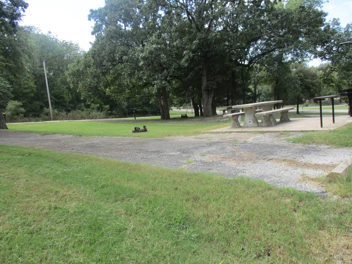 Site 16 drive - Rocky PointSite 16 has an asphalt drive and concrete picnic table.