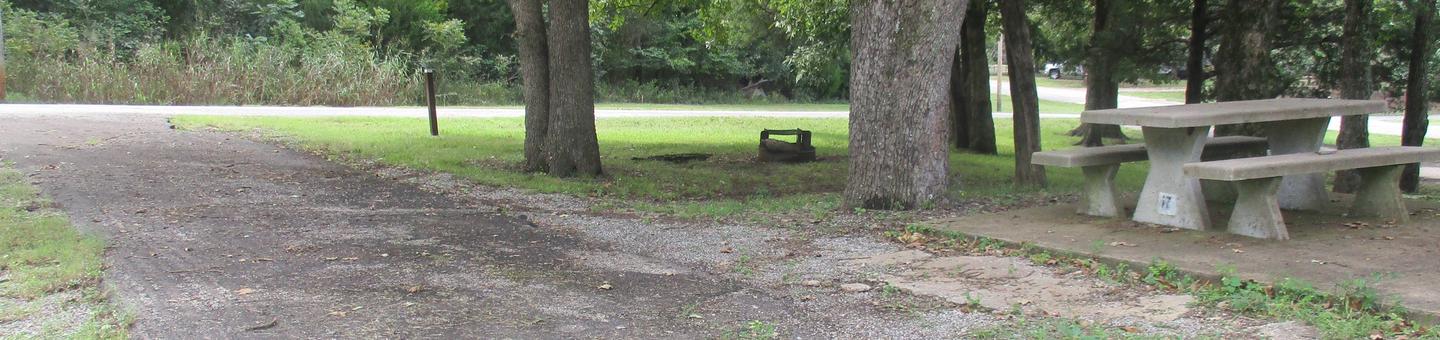 Site 17 - Rocky PointSite 17 offers an asphalt drive with concrete picnic table.