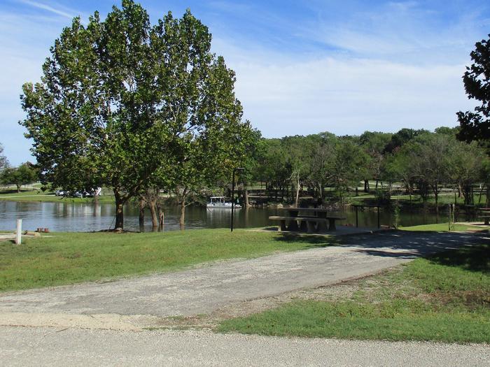 Site 46 - Rocky PointSite 46 offers an asphalt drive with partial shade.  It also offers easy access to the water.