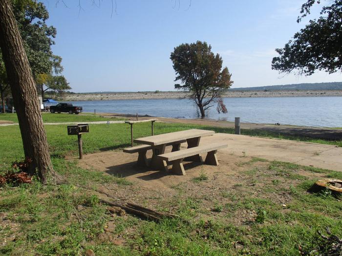 Site 41 - Taylor FerrySite 41 offers a concrete picnic table, utility table, pedestal grill and fire ring.