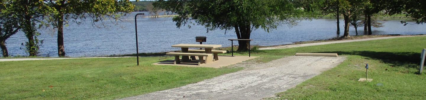 Site 58 - Rocky PointSite 58 is located near the swim beach and offers easy access to the boat ramp and courtesy dock.