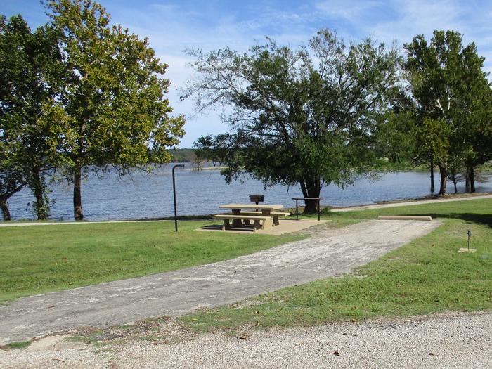 Site 58 - Rocky PointSite 58 is located near the swim beach and offers easy access to the boat ramp and courtesy dock.