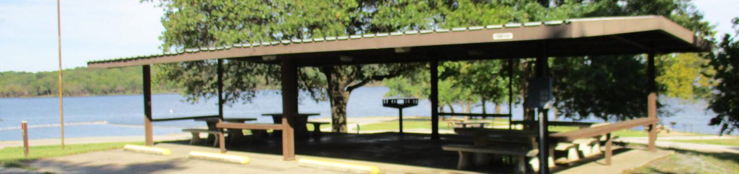 Rocky Point Day Use ShelterThe Rocky Point Day Use Shelter (RPS) offers 4 concrete picnic tables, large pedestal grill, wood utility tables, and several 110 electrical outlets.