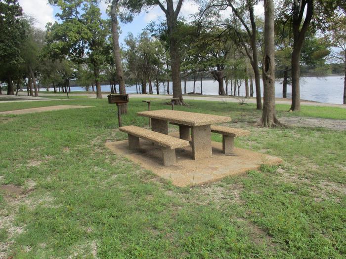 Site 22 - Blue BillSite 22 offers a concrete picnic table, pedestal grill, utility table and fire ring.  It offers two asphalt drives for parking.