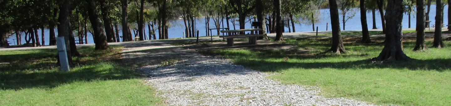 Site 16 - Blue BillSite 16 is a pull through site with ample shade and a nice lake view.