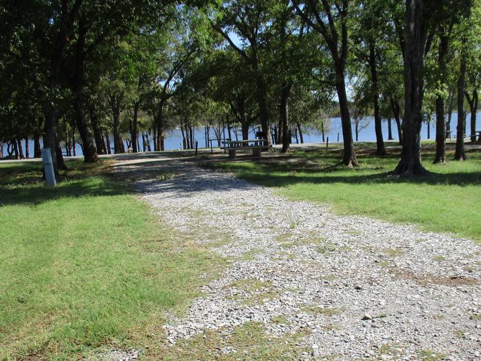 Site 16 - Blue BillSite 16 is a pull through site with ample shade and a nice lake view.