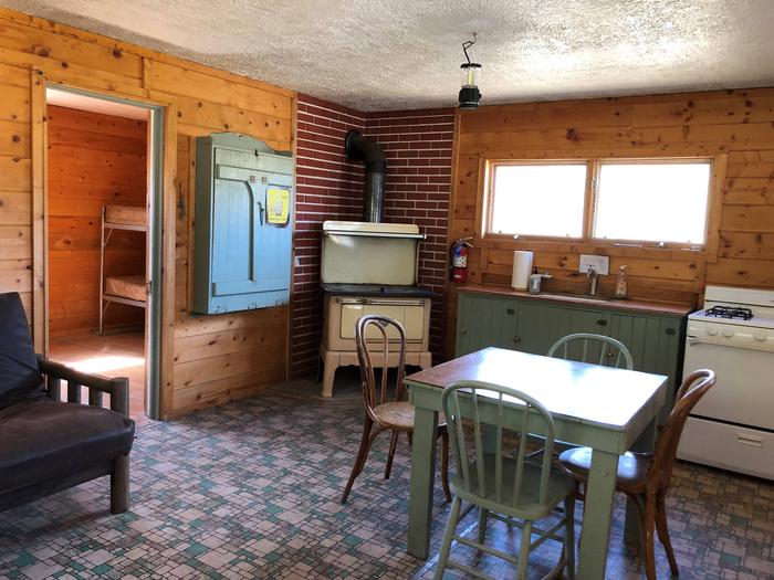 Woodstove, table and chairs, gas range and sinkFront Room of Cabin