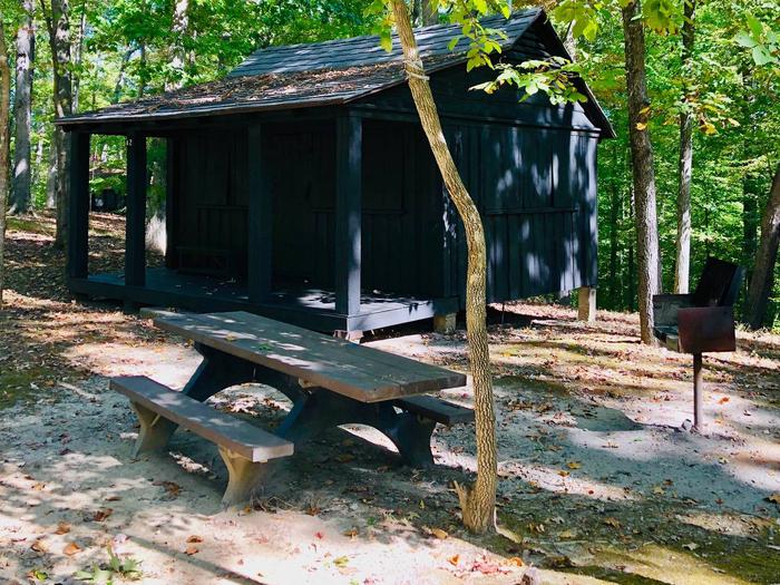 Each cabin has a picnic table and charcoal grill located nearby.
