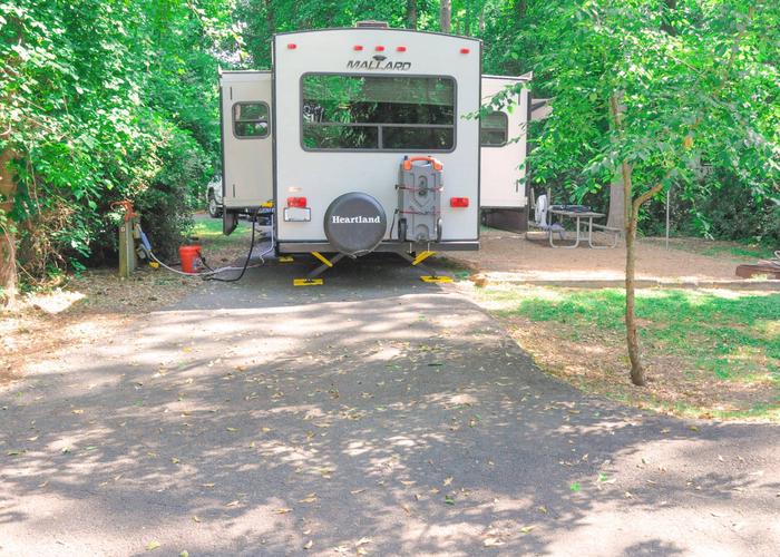 Pull-thru entrance, driveway slope, awning-side clearance, utilities-side clearance.Victoria Campground, campsite 69.