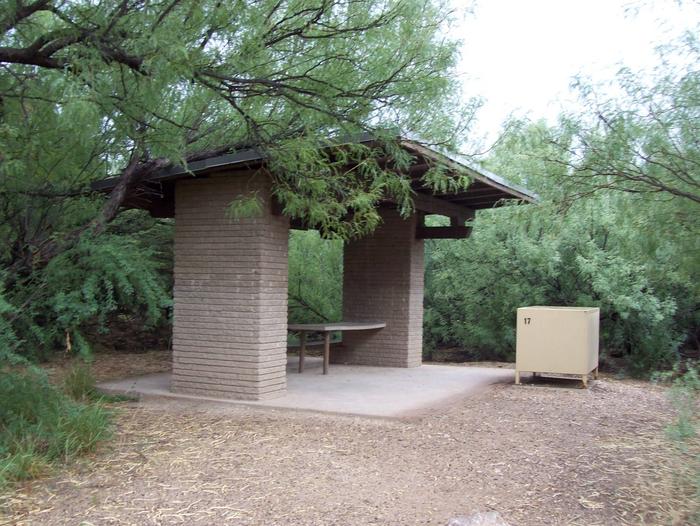 Site with a shade shelter surrounded by vegetation.Shade shelter at Site #17.