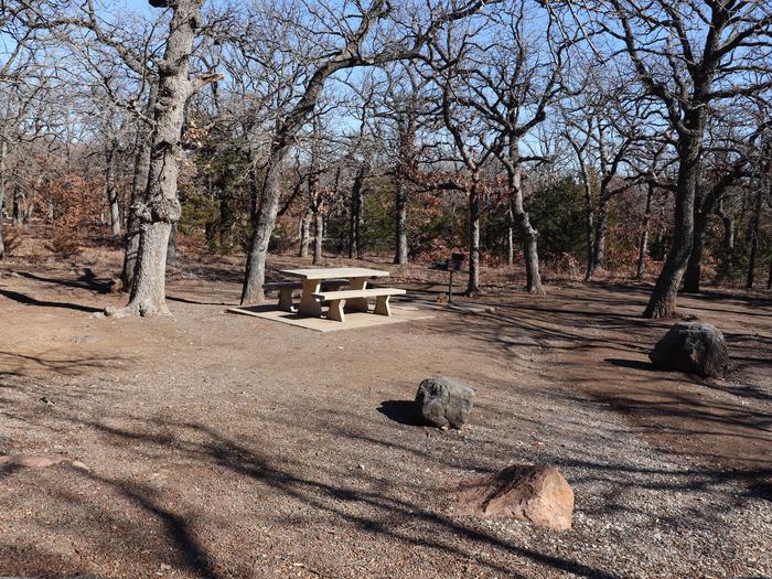 A spacious campsite with plenty of shade trees.Campsite 23