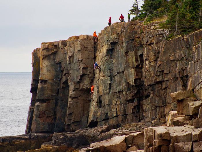Climbers ascend Otter Cliffs at Acadia National ParkClimbers ascend Otter Cliffs at Acadia National Park.