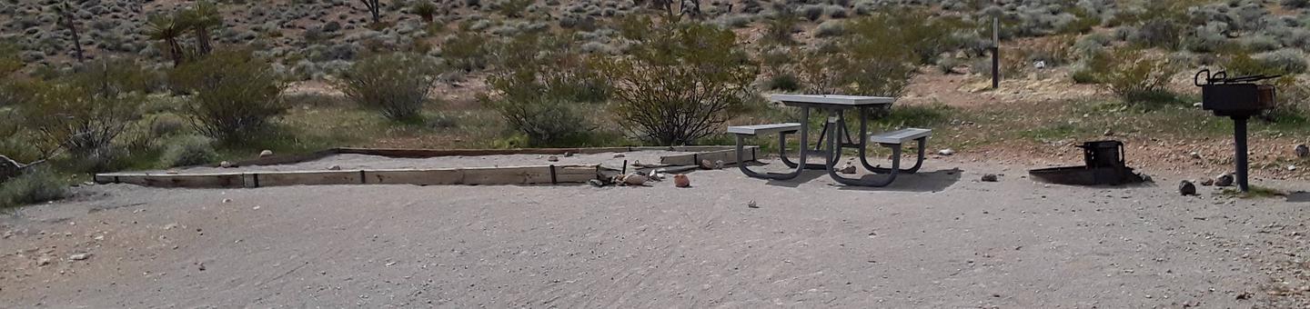 Red Rock Canyon Campground Standard Site 50Red Rock Canyon Campground Standard Site that has a large tent site and a fire pit. This site as well has a bbq grill and a picnic table. Parking is along the road and there is enough room for the two vehicles allowed.