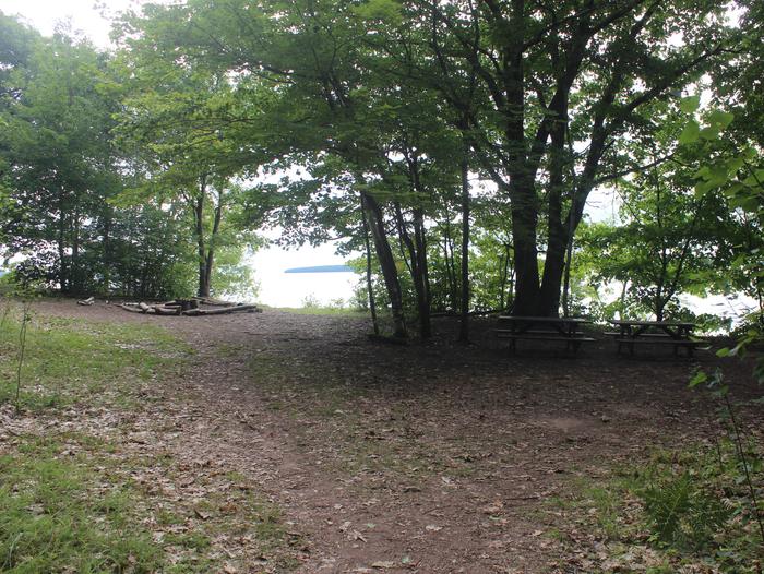 Oak site A with fire ring, two picnic tables, and lake viewOak site A