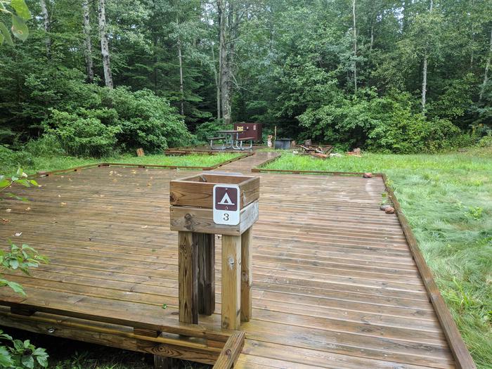 Sand site 3 - wooden platform, accessible bear box, picnic table, and fire ringSand site 3 - accessible site
