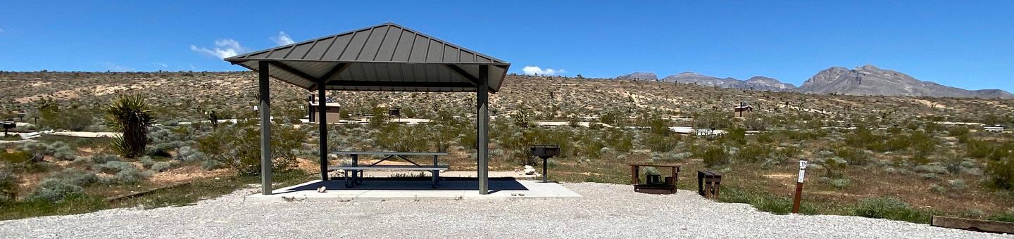 Red Rock Standard site 15Standard site that includes a shelter over a nice concrete pad and a picnic table. A very large tent pad and a fire pit and sitting area. Plenty of parking for the two vehicles allowed  per reservation or a 
recreational vehicle and a vehicle.