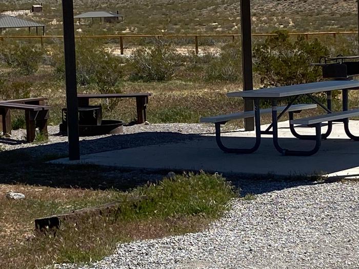 Red Rock Canyon Campground Standard Site 9site has a nice shelter over a picnic table on a nice concrete slab. site has a large tent pad and plenty of parking for the two vehicles required for a reservation or a recreational vehicle and vehicle 