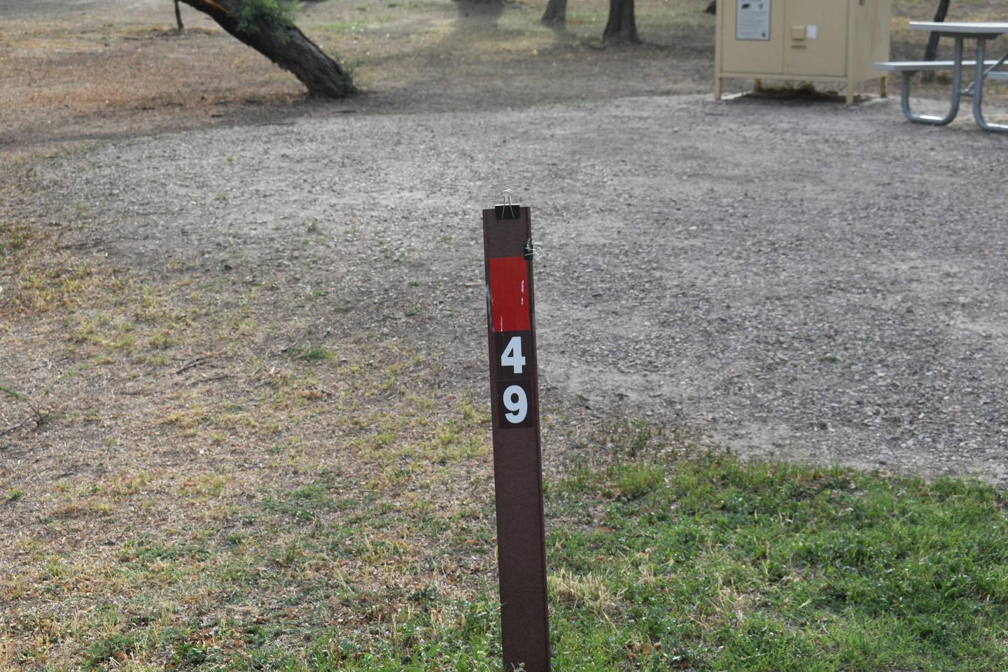 Brown site maker with red sticker for Site 49Site marker for Site 49
