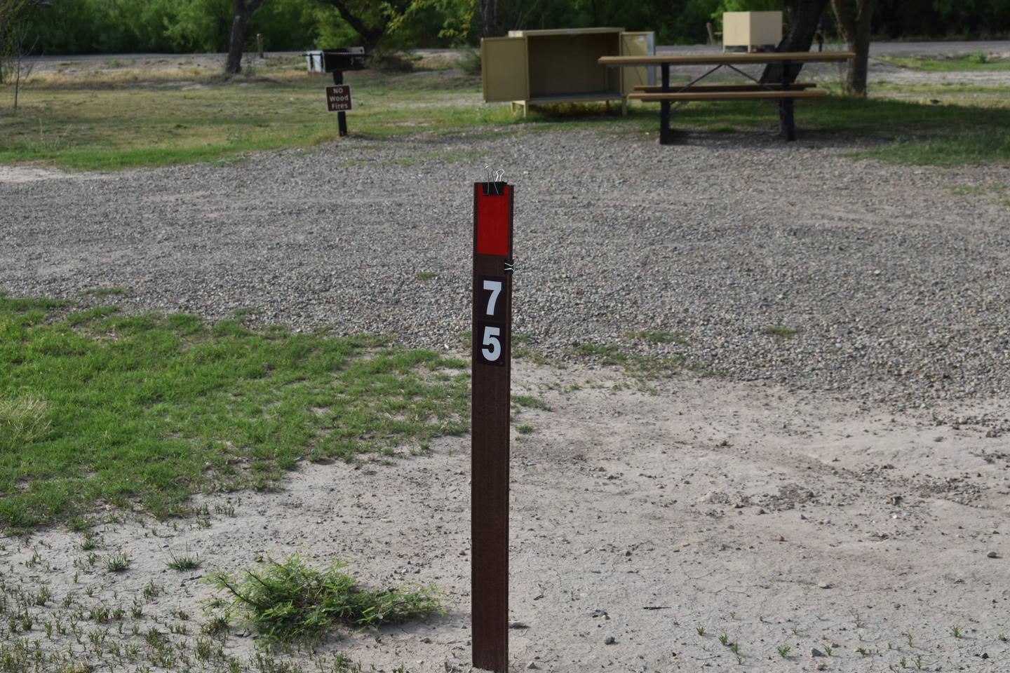 Brown site marker with red stickerSite marker for Site 75