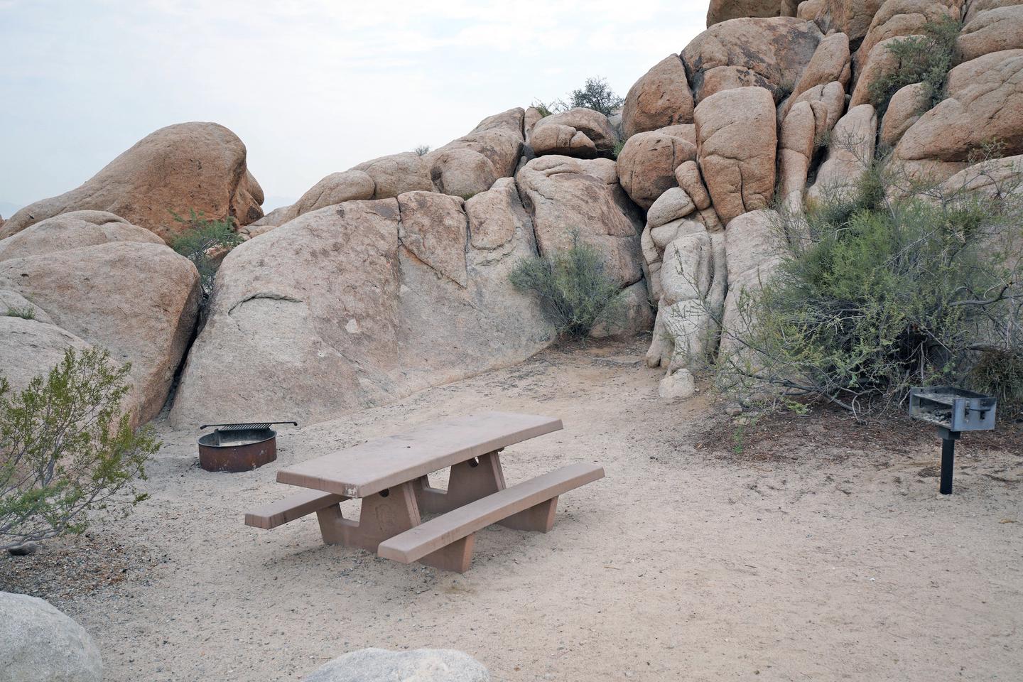  Campsite  with picnic table surrounded by boulders.Campsite.