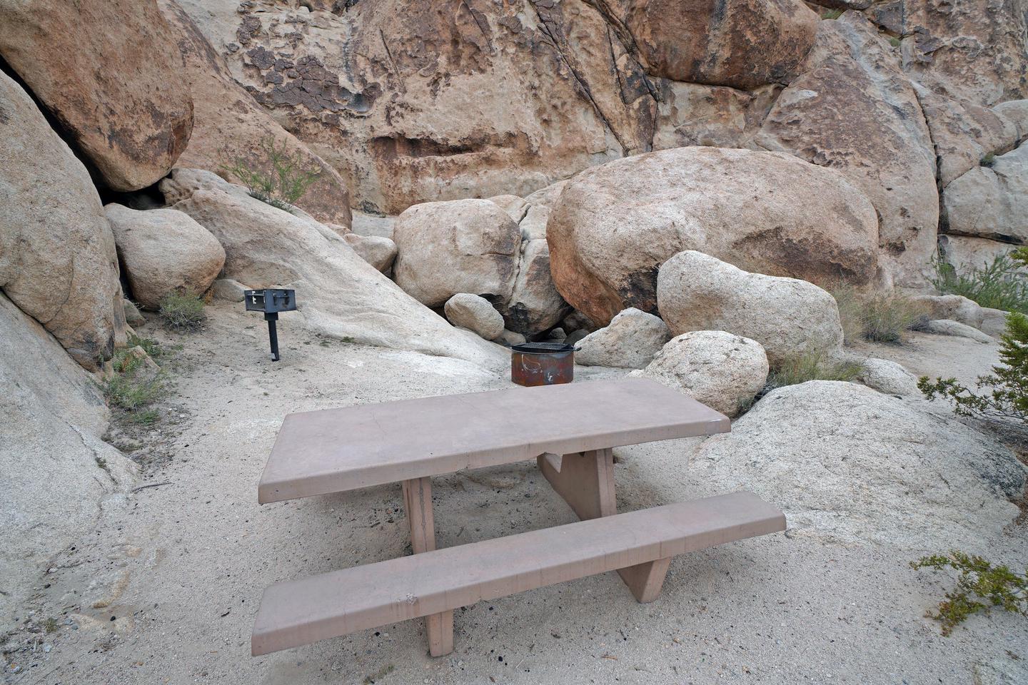 Campsite  with picnic table surrounded by boulders .Campsite.