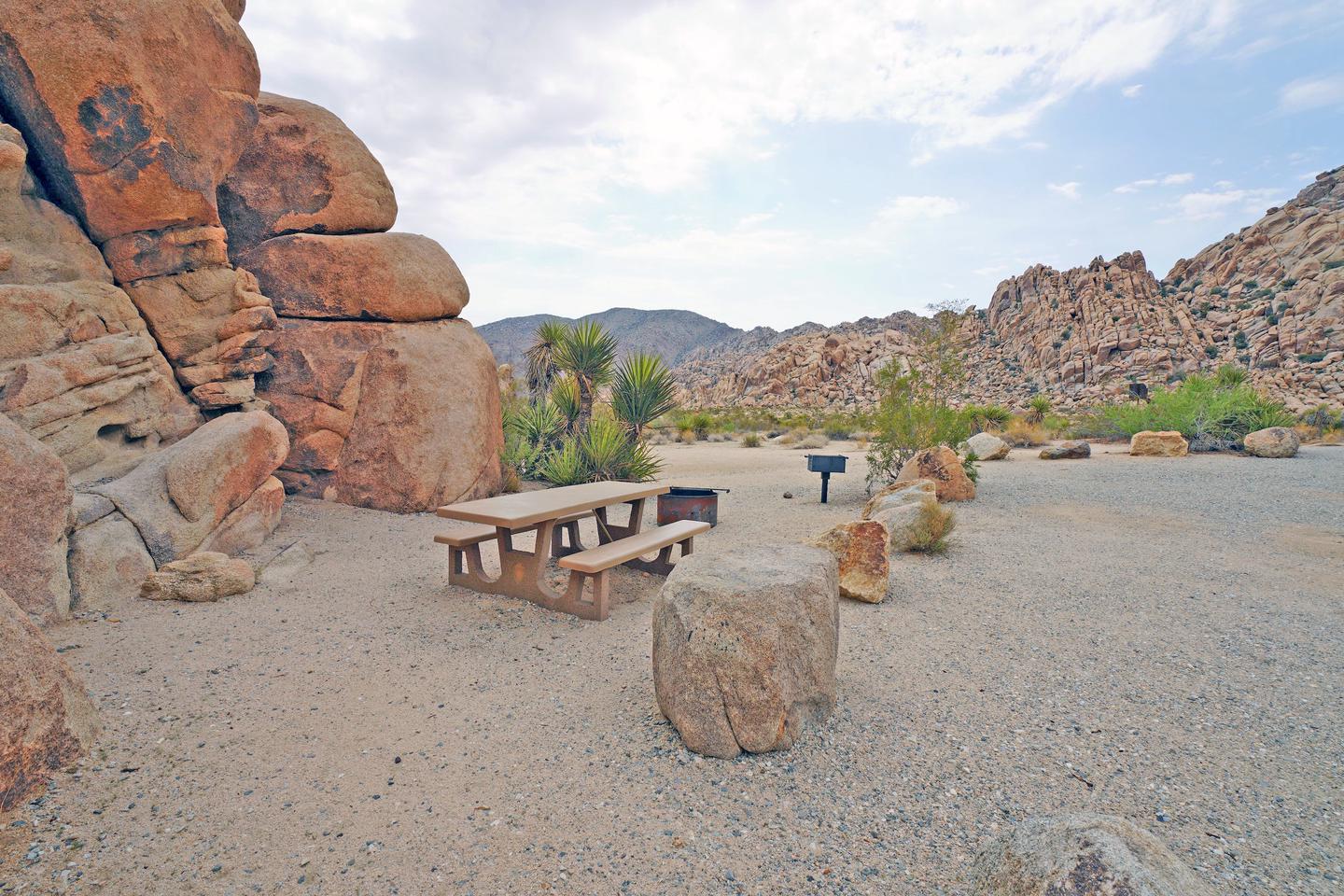 Campsite  with picnic table surrounded by boulders .Campsite.