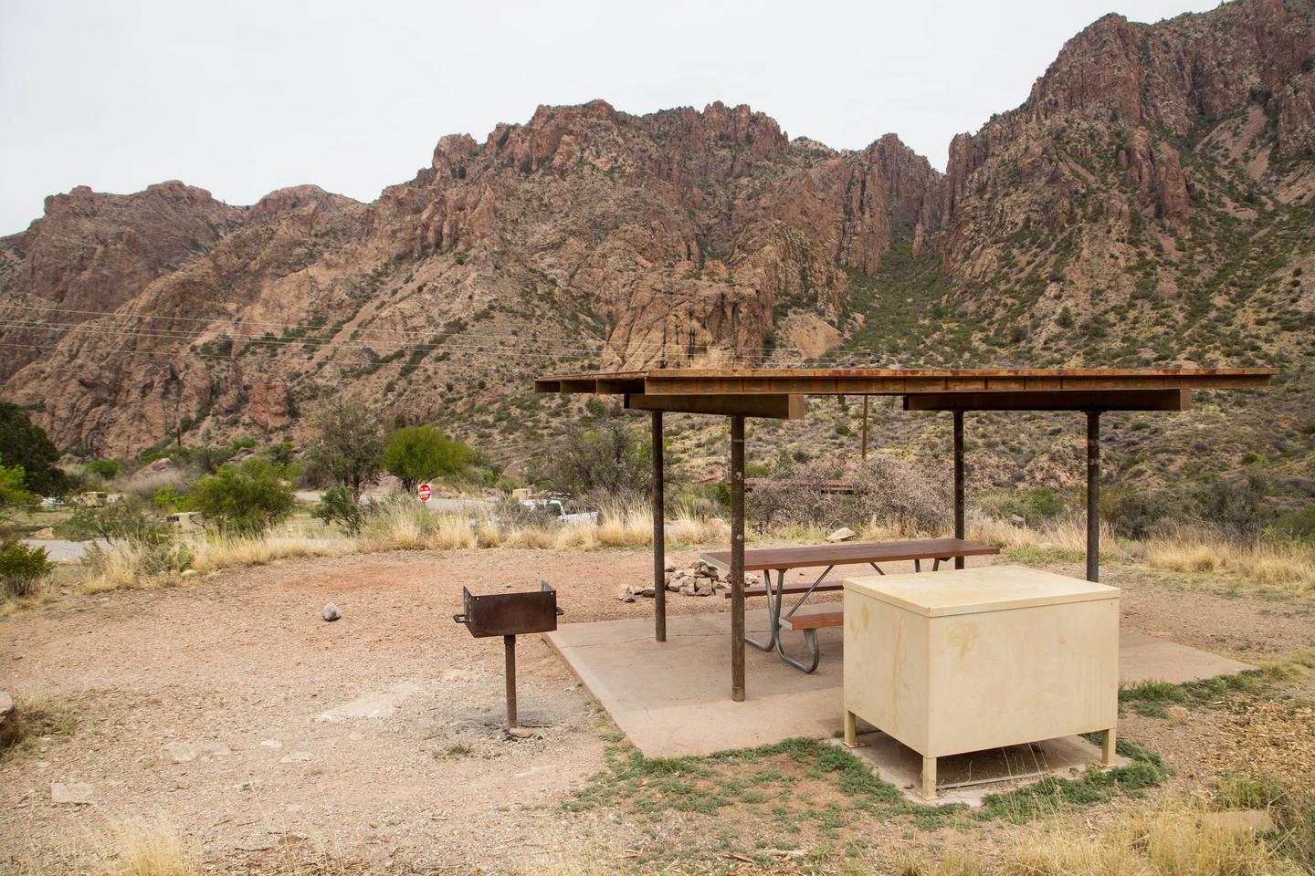 Chisos Basin Campsite #21 shade ramadaView showing grill, shade ramada, picnic table, and bear box