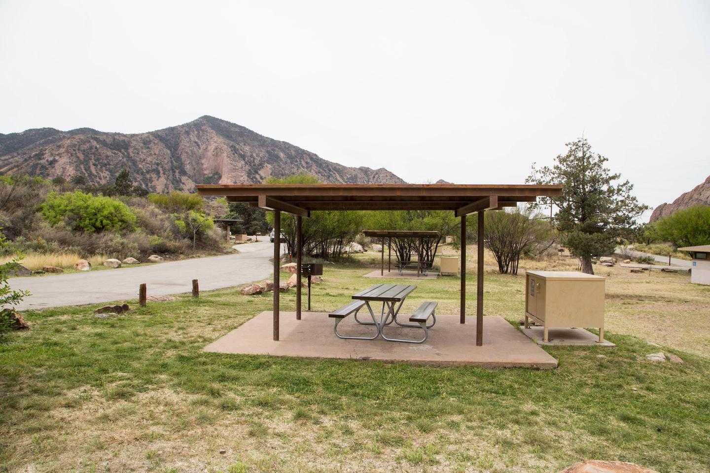 Chisos Basin Campsite #23 side viewShowing shade ramada, picnic table, and bear box