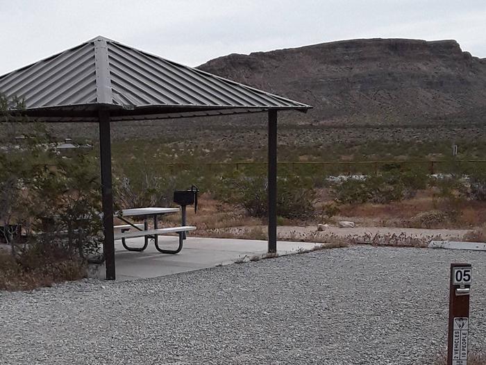 Red Rock Canyon Campground Standard Site 5The standard site offers a nice shade structure with a picnic table and a fire pit with sitting area. A large tent pad and a bbq. There is plenty of room for the two vehicles allowed per reservation