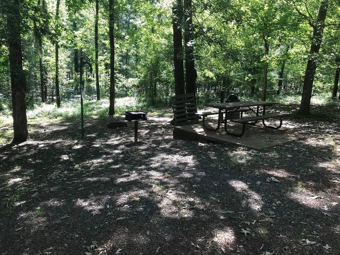 Campsite #12.Campsite #12. Tent site with the following amenities: fire-pit, grill, picnic table, lantern pole, trash can.