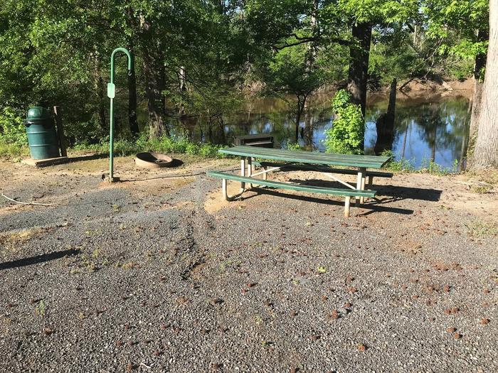 Campsite #2.Campsite #2. Tent site with the following amenities: fire-pit, grill, picnic table, lantern pole, trash can.  Located along bayou.