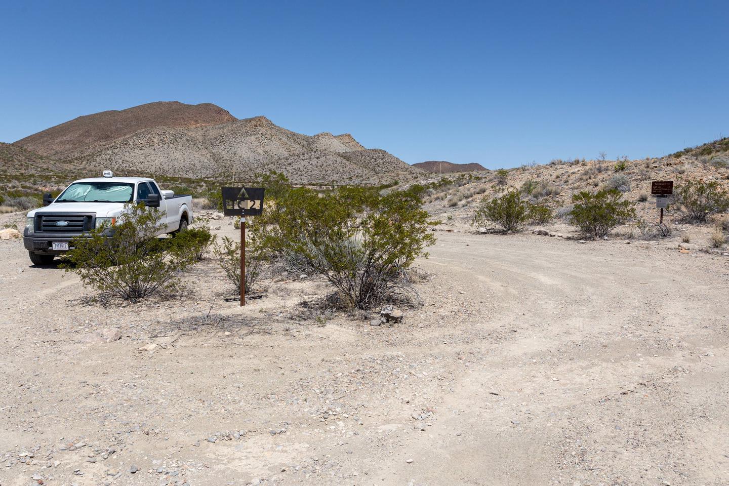 Camping area with desert mountain backgroundParking and camping area